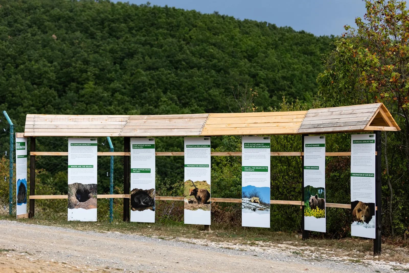 A row of information panels about the bears beside the sanctuary path.